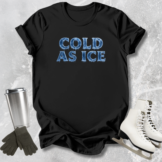 Black t-shirt with 'COLD AS ICE' text, silver tumbler, gloves, and skates on a textured gray background