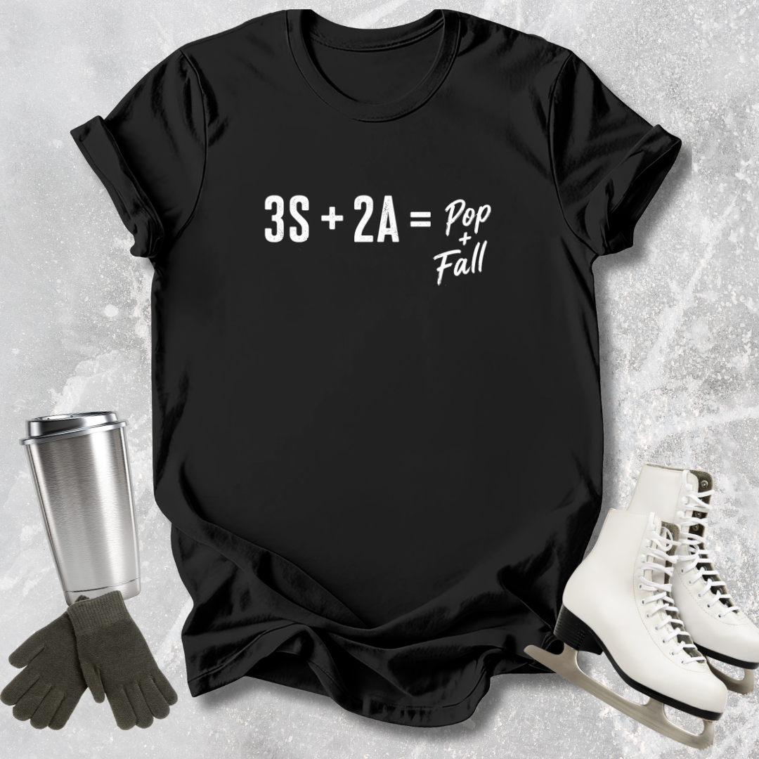 Black t-shirt with mathematical equation, surrounded by ice skates and a tumbler on a textured surface.