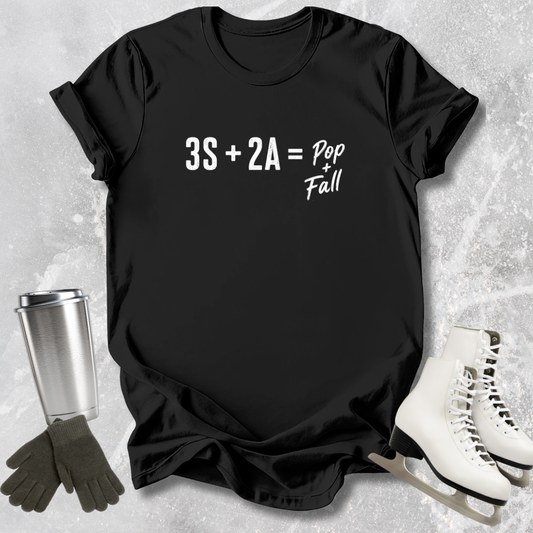 Black t-shirt with mathematical equation, surrounded by ice skates and a tumbler on a textured surface.