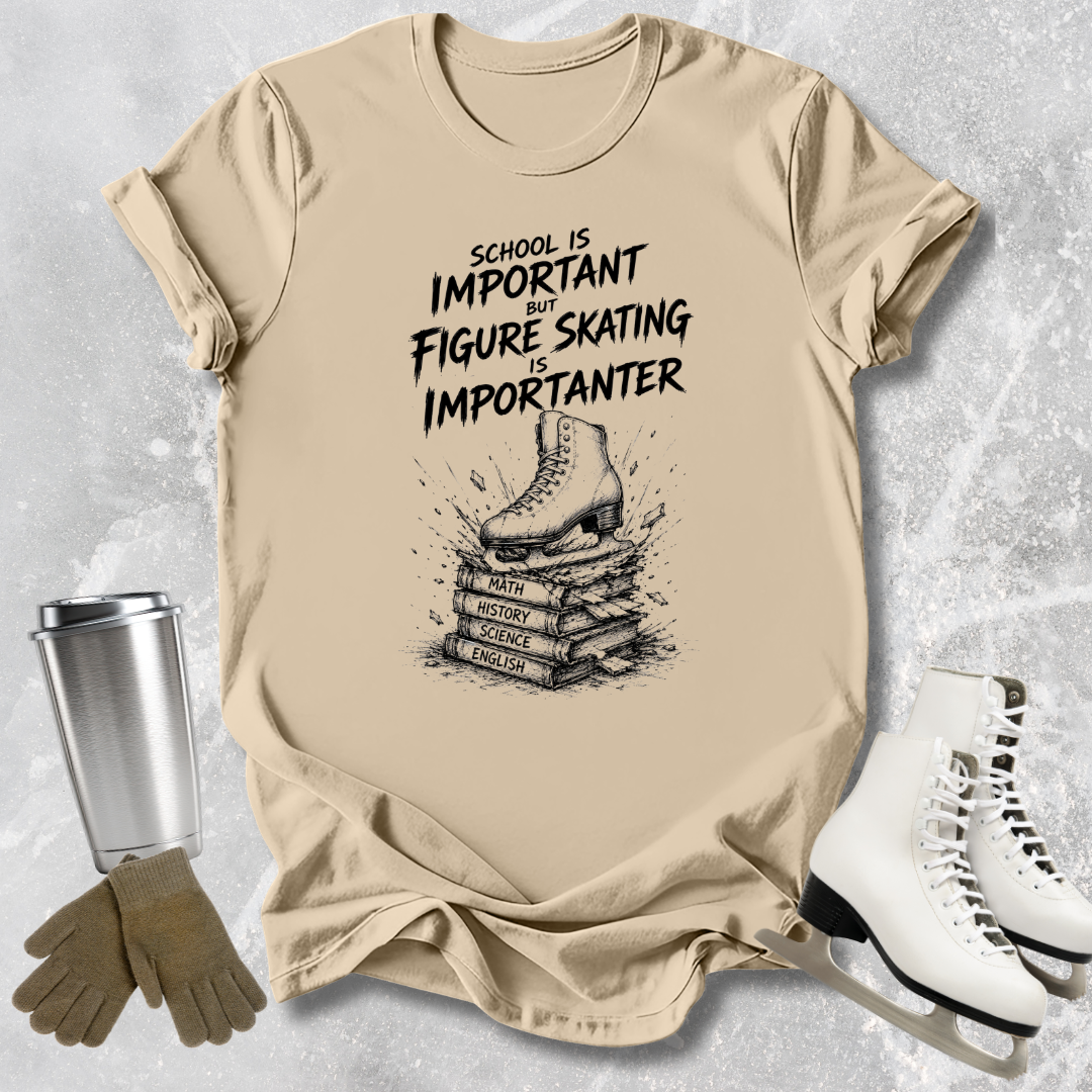 Beige t-shirt with figure skating design and text, surrounded by ice skates and a tumbler.