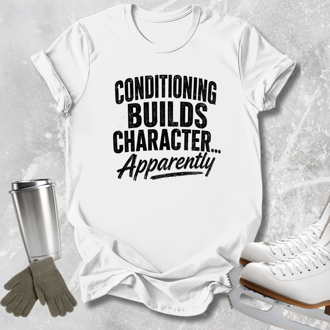 A white short-sleeve T-shirt laid flat on a light gray textured background, printed with the phrase 'CONDITIONING BUILDS CHARACTER.