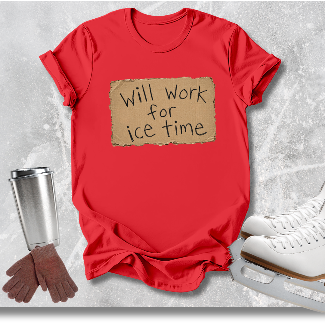 A red short-sleeve graphic T-shirt laid flat on a light gray textured surface, with a torn cardboard-style patch on the chest reading 'Will work for ice time.' Ice skates, gloves, and a metal cup are placed around it as styling props.
