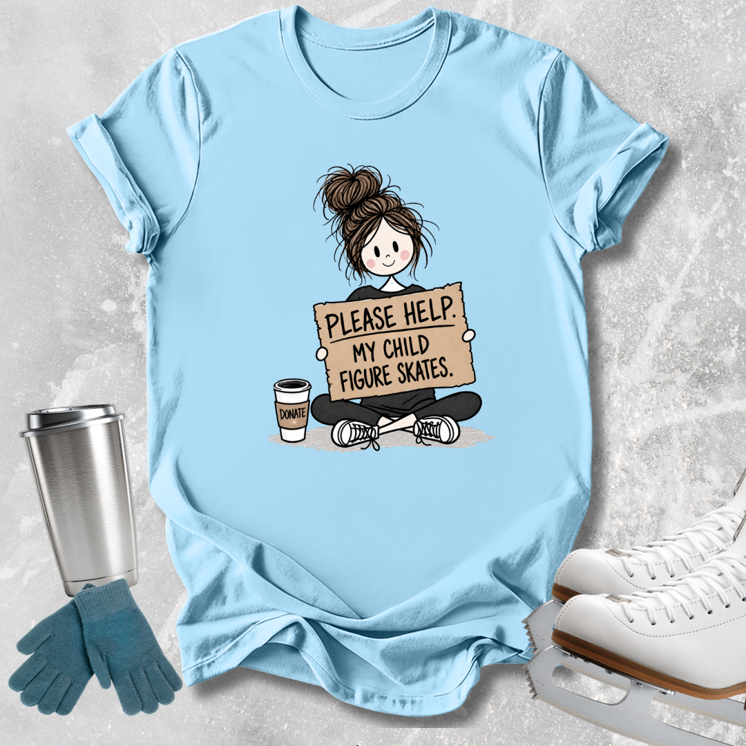 A light blue graphic t-shirt laid flat on a textured gray background, surrounded by ice skating props including white ice skates, blue gloves, and a stainless steel tumbler. The t-shirt features a cartoon illustration of a girl with a bun holding a sign that reads 'PLEASE HELP MY CHILD FIGURE SKATES' next to a coffee cup.