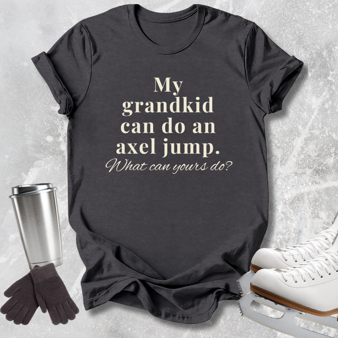 A dark charcoal gray graphic t-shirt with the text 'My grandkid can do an axel jump. What can yours do?' printed in cream.