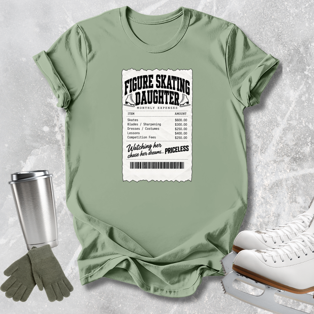 A sage green graphic t-shirt laid flat on a light gray textured background, styled with a stainless steel travel mug, gray gloves, and white ice skates. The t-shirt features a white ticket-style graphic that reads 'FIGURE SKATING DAUGHTER' with a list of expenses.