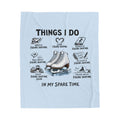 A light blue fabric towel featuring a black printed graphic with the text 'THINGS I DO IN MY SPARE TIME' and illustrations of figure skates and skates with labels around a pair of white ice skates.